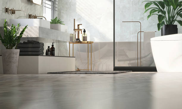 Baño amplio con bañera central y zonas delimitadas de lavabo